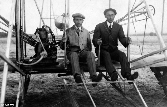 Wilbur Wright and Orville Wright on the Wright Flyer I in 1910.