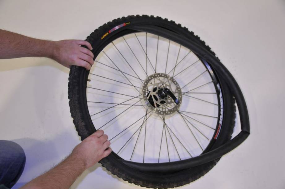 checking the tube of a punctured bike tyre