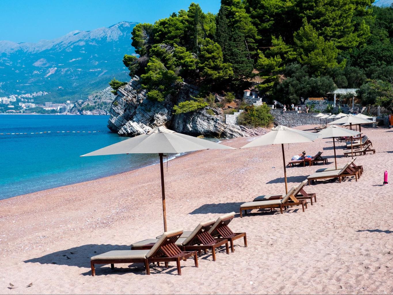 Sunbeds and umbrellas fill the beaches in Montenegro