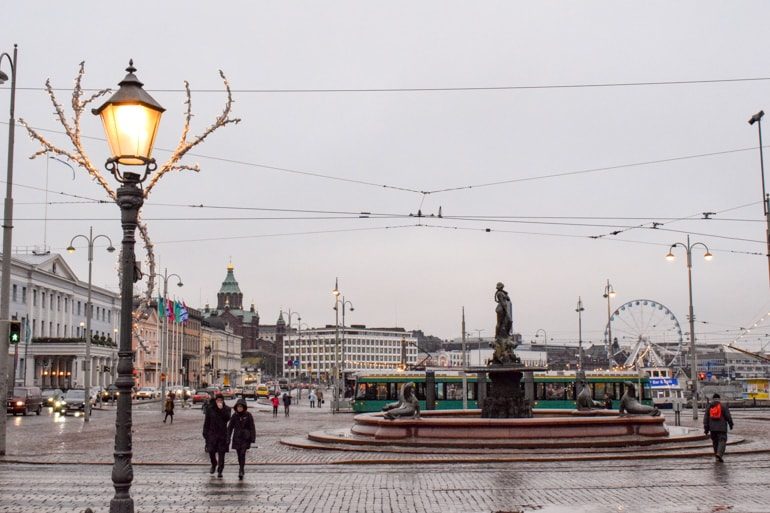market square in helsinki with fountain and harbour cand street light post one day in helsinki